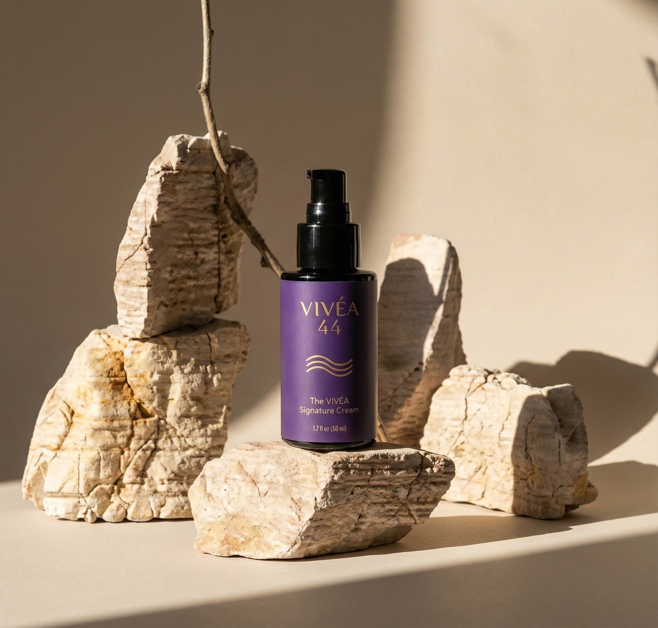 Vivea 44 bottle on a stone surface with a neutral background